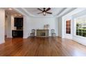Bright living room featuring hardwood floors, wet bar and large windows at 265 Dogwood Walk Ln, Norcross, GA 30071