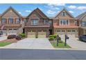 Attractive townhomes with brick facades, two-car garages, and neatly landscaped front yards at 1929 Brightleaf Way, Marietta, GA 30060