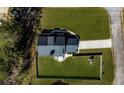 Aerial shot of property showing roofline, backyard and well-maintained lawn at 8007 Wishaw Ct, Winston, GA 30187