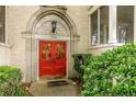 Close-up of the home's entrance featuring a red door with diamond-patterned glass and classic architecture at 2230 Peachtree Ne Rd # A-3, Atlanta, GA 30309