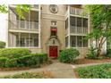 Charming multi-Gathering home with a red door, screened balconies, and well-maintained landscaping at 2230 Peachtree Ne Rd # A-3, Atlanta, GA 30309
