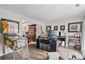 Spacious home office with desk, laminate floors, computer setup and pinball machine at 565 Barsham Way, Johns Creek, GA 30097