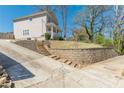 Wide driveway featuring stone retaining wall and plenty of parking at 1303 Hill Se St, Atlanta, GA 30315