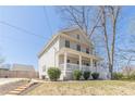 Beautiful two-story home featuring a classic front porch and landscaped front yard at 1303 Hill Se St, Atlanta, GA 30315