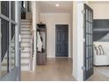 Inviting foyer with natural light, coat rack, and stylish flooring, leading to the main living area at 525 Rubato Knl, Mcdonough, GA 30253