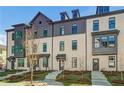 Attractive multi-level townhome with a combination of brick and siding and well-maintained landscaping at 525 Rubato Knl, Mcdonough, GA 30253