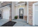 A close-up of the front door showing the entryway with stone and siding details at 1954 Durwood Ln, Duluth, GA 30096