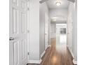 Inviting hallway featuring wood floors and access to other rooms in the home at 1954 Durwood Ln, Duluth, GA 30096