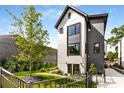 Charming home with a well-maintained lawn, beautiful landscaping, and a modern two-story elevation at 219 Howell Se Dr # A, Atlanta, GA 30316