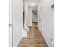 Bright hallway with wood-look floors, white walls and trim, leading to the main living areas at 3181 Meadowstone Sw Ln, Atlanta, GA 30331