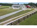 Lovely exterior view of home featuring a wide-open lawn, a barn, and ample parking at 654 Euharlee Five Forks Rd, Kingston, GA 30145