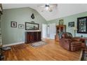 Well-lit living room with vaulted ceiling, hardwood floors, and comfortable seating at 654 Euharlee Five Forks Rd, Kingston, GA 30145