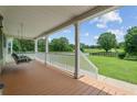 Relaxing front porch with a swing, offering scenic views of the surrounding countryside at 654 Euharlee Five Forks Rd, Kingston, GA 30145