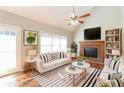 Inviting living room with a fireplace, high ceilings, and lots of natural light at 1416 Emerald Pine Ct, Lawrenceville, GA 30043