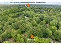 Aerial shot of the property's proximity to downtown Roswell and Roswell Mill, nestled among lush greenery at 175 River Run, Roswell, GA 30075