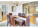 Dining room with hardwood floors, an elegant chandelier and adjacent living spaces at 1043 Elizabeth Ne Ct, Atlanta, GA 30306