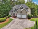 Stunning two-story home with lush landscaping, two-car garage, and inviting curb appeal at 2485 Millwater Xing, Dacula, GA 30019