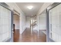 Elegant foyer with hardwood floors, paneled walls, and staircase leading to the upper level at 4240 Summer Breeze Way, Buford, GA 30518