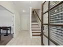 Bright foyer with tiled floors and staircase, leading to the upper level of the home at 600 Luckett Ct, Smyrna, GA 30080
