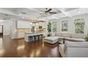 Open concept living space featuring hardwood floors, coffered ceilings, and abundant natural light at 600 Luckett Ct, Smyrna, GA 30080