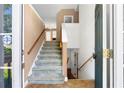 Inviting entryway featuring stairs leading upstairs and downstairs at 90 Cypress Dr, Covington, GA 30016