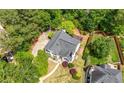 Aerial view of residence featuring well-maintained landscape and mature trees at 9206 Denmeade Trce, Douglasville, GA 30135
