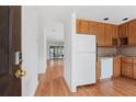 Inviting kitchen features warm wood cabinets and modern appliances, open to a spacious layout at 1104 Country Ct, Lawrenceville, GA 30044