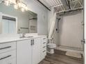 Bright bathroom featuring a white vanity, toilet, and subway tiled shower with glass door at 195 Arizona Ave # 179, Atlanta, GA 30307