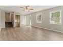 Bright living room featuring hardwood floors, large windows and neutral colors at 708 Wind Song Trce, Woodstock, GA 30189