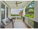 Inviting front porch with rocking chairs, ceiling fan, and views of the neighborhood at 2610 Cheney St, Atlanta, GA 30344