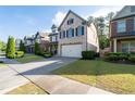 Pleasant two-story brick home with a well-kept lawn, neat landscaping, and an attached two-car garage at 2800 Tuscany Park Dr, Lawrenceville, GA 30043