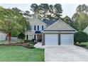 Charming two-story home with well-maintained landscaping and a two-car garage in a suburban neighborhood at 1171 Pine Acre Dr, Sugar Hill, GA 30518