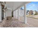 Brick porch and columns with gray siding at 1005 Coleman Place Dr, Roswell, GA 30075