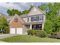 Two-story house with brick front, two car garage and well-maintained landscaping at 2365 Valley Mill Dr, Buford, GA 30519