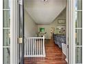 View of entryway with hardwood floors, and natural light streaming through large windows, creating a warm, inviting atmosphere at 6645 N Glen Dr, Cumming, GA 30028