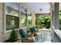Relaxing front porch seating area with comfortable chairs and natural light at 1920 Jett Ridge Rd, Cumming, GA 30041