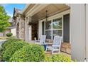 Inviting front porch with rocking chairs and decorative stone pillars at 4779 Bogan Meadows Dr, Buford, GA 30519