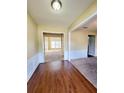 Open living space with hardwood floors and fresh carpeting to the other room at 6005 Pattingham Dr, Roswell, GA 30075