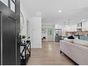 Open-concept living space with hardwood floors and a modern kitchen at 1643 Flintwood Se Dr, Atlanta, GA 30316