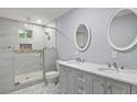 Elegant bathroom with a glass-enclosed shower and double vanity sinks at 856 Bridgewater Sw St, Atlanta, GA 30310