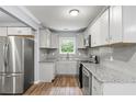 Modern kitchen featuring stainless steel appliances and granite countertops at 856 Bridgewater Sw St, Atlanta, GA 30310