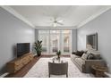 Comfortable living room with sleek furniture, plush rug, and bright natural light from the large windows at 400 17Th Nw St # 1253, Atlanta, GA 30318