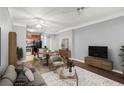 Stylish living room with modern open floor plan, neutral tones, and seamless flow to the kitchen at 400 17Th Nw St # 1253, Atlanta, GA 30318