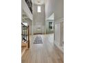 Bright foyer features high ceilings, hardwood floors and paneled wainscoting at 297 Delta Dr, Mcdonough, GA 30252