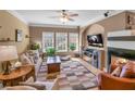 Inviting living room with a fireplace, a large window, neutral paint, and hardwood flooring at 506 Glen Ivy # 5, Marietta, GA 30062