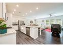 Spacious kitchen with stainless steel appliances, granite countertops, and a large central island at 668 Isom Walk, Suwanee, GA 30024