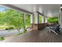 Inviting front porch with wood floors, brick accents and comfortable seating, offering a relaxing outdoor space at 1020 Austin Ne Ave, Atlanta, GA 30307