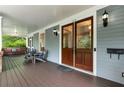 Spacious front porch with seating, wood floors, and classic details, perfect for enjoying the outdoors at 1020 Austin Ne Ave, Atlanta, GA 30307
