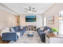 Spacious living room features two comfortable couches, modern entertainment center, and plenty of natural light at 161 Overlook Cir, Canton, GA 30115