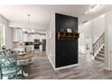 Bright kitchen featuring white cabinets, stainless steel appliances, and hardwood floors at 275 Creek View Place, Canton, GA 30114